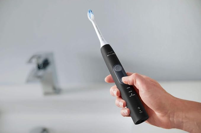 Philips Sonicare ProtectiveClean 5300 Rechargeable Electric Toothbrush, with Pressure Sensor, 3 Cleaning Modes, SmarTimer and QuadPacer, with 2 Bonus Brush Heads, Travel Case, Black, Model HX6423/34